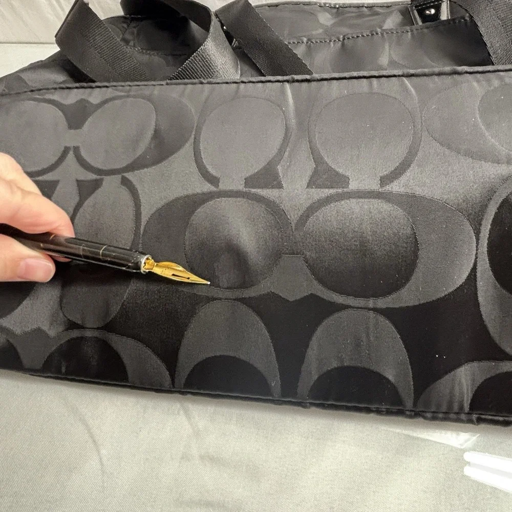 Coach black signature